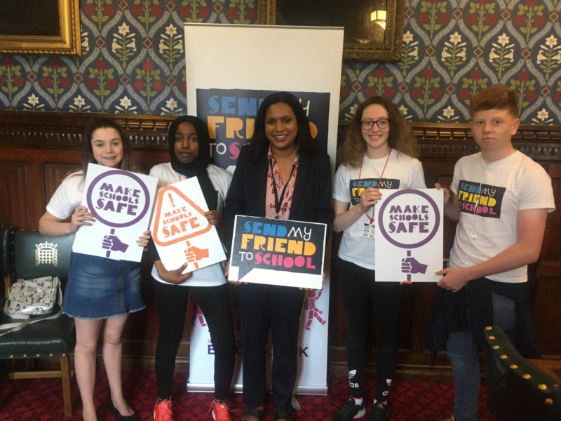 Janet with young representatives from the Send my Friend to School campaign