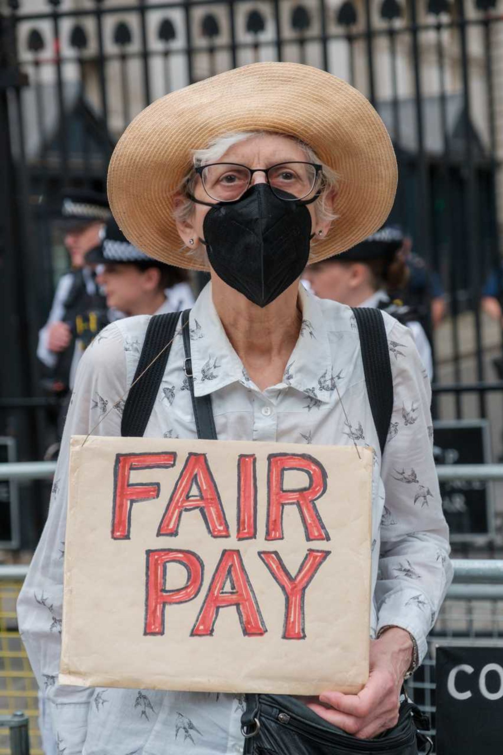 Women holding a sign reading