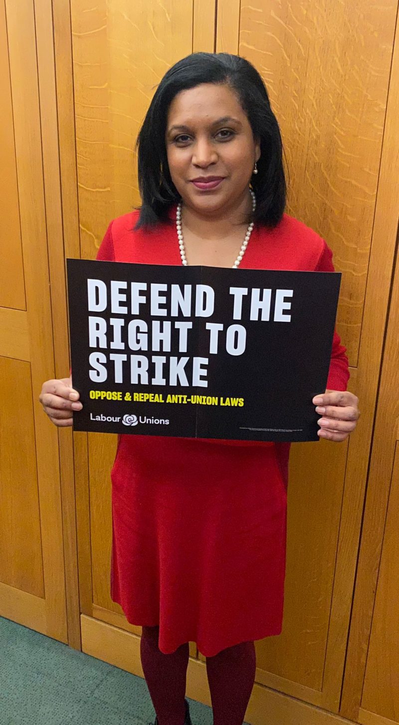 Janet Daby MP holding sign saying "Defend the right to strike. Oppose & repeal anti union laws"