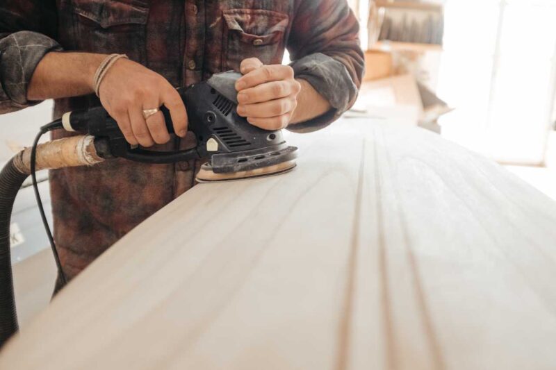 Person sanding down wood