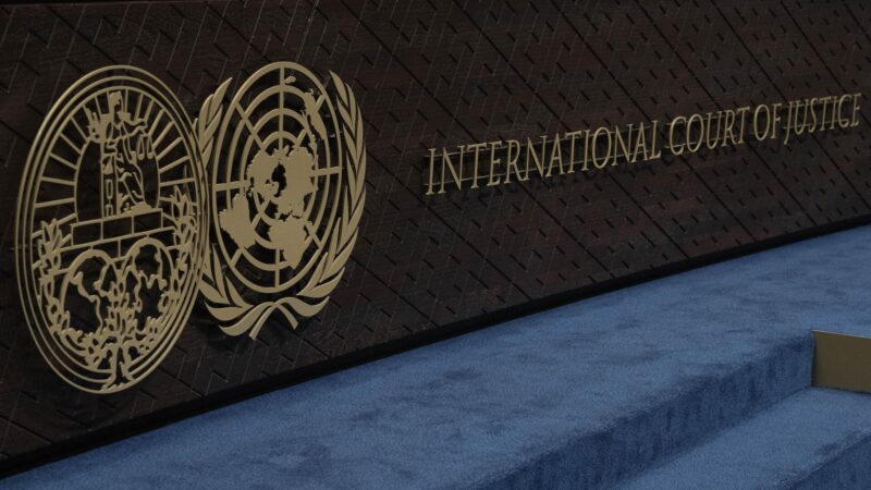 Bench where the judges at the International Court of Justice sit, with the ICJ logo and the words 
