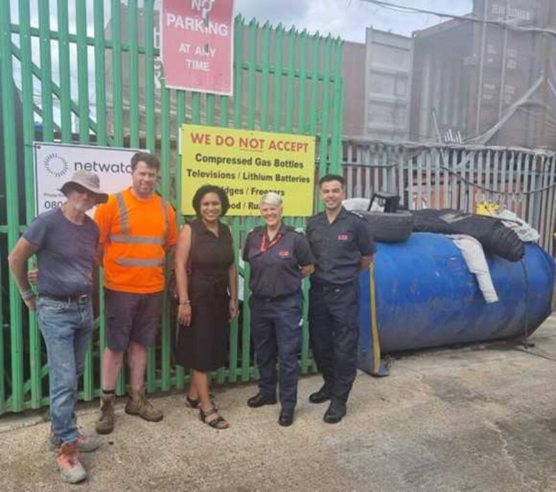 Janet Daby MP with Cllr Eva Stamirowski and residents in front of a black board with information on 