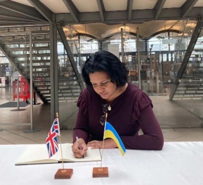 Janet Daby MP signing the book of Solidarity